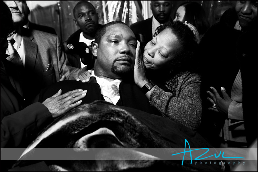 Emotional Moment Wedding Photography The groom is hugged by his mother during the reception at his wedding near Raleigh.