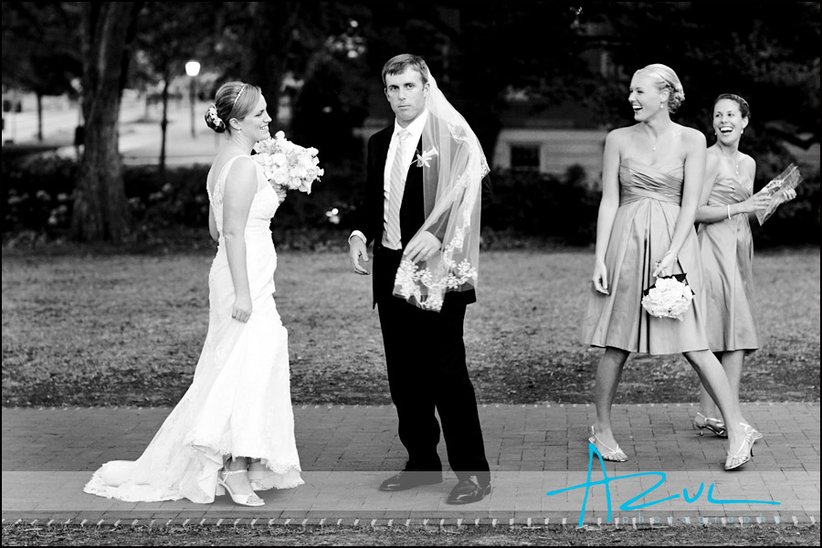 Humorous Wedding Photography Image Outside the Carolin Inn the groom has a little fun with the bride's veil.