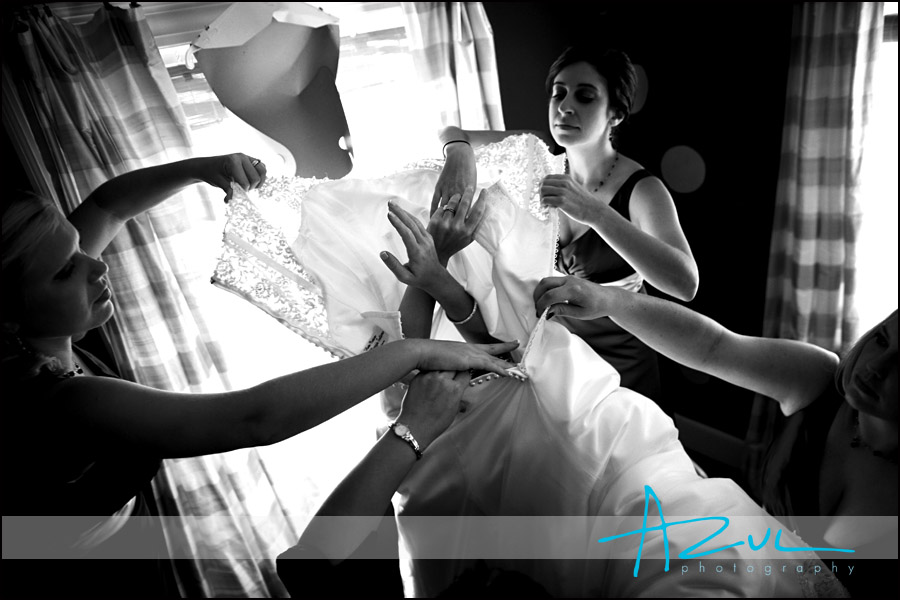 Wedding Dress Fuqay Varina A bride slips into her dress while at Highgrove Estate Mansion before the wedding ceremony.