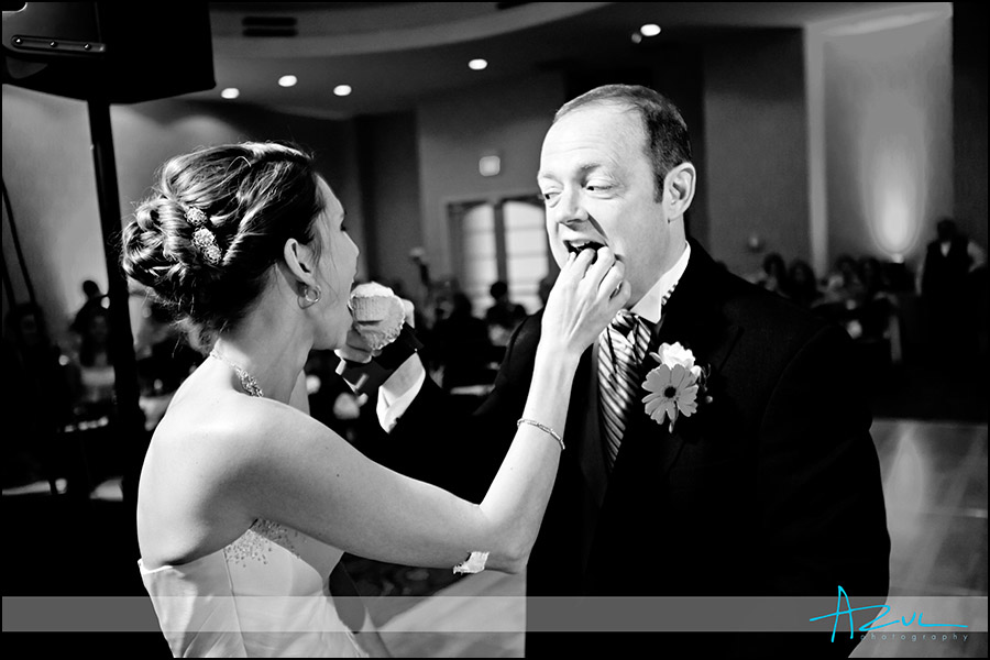Wedding day tasting of the cake photograph Raleigh NC