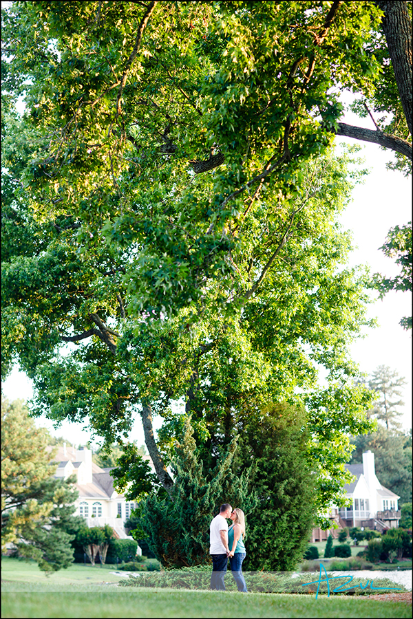 Under the big tree Kissing engagement portrait session Cary NC