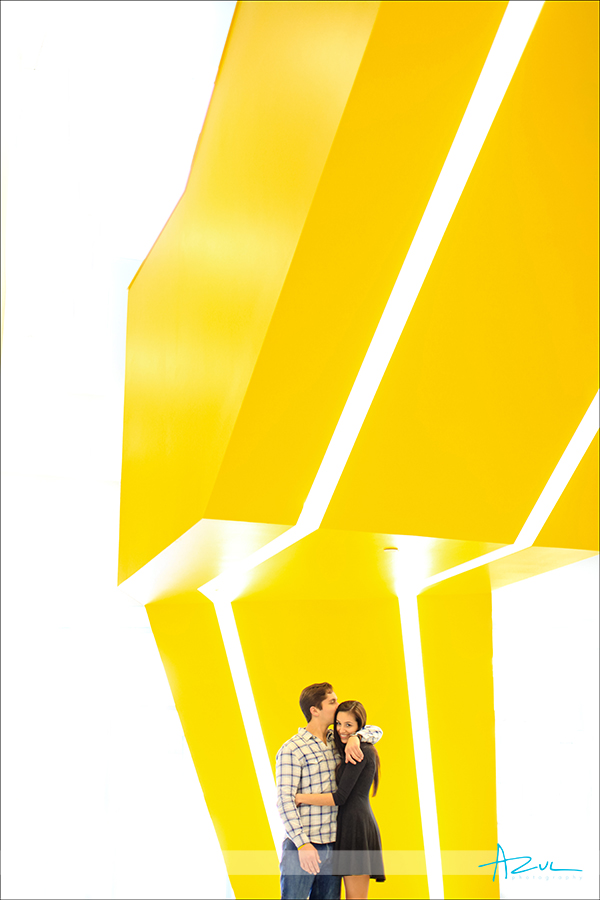 Yellow stairwell NC State engagement portrait session Raleigh