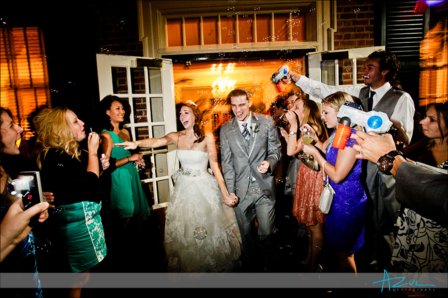 Extreme bubble exit Perfect wedding day photography exit photo of bride and groom